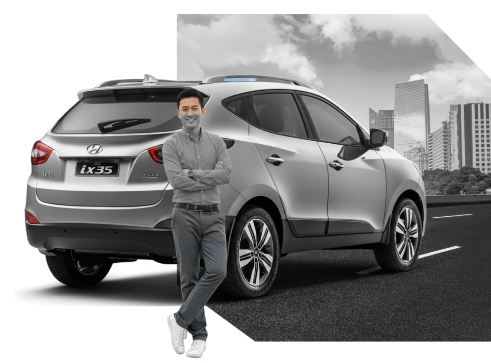 Driving instructor standing beside a car